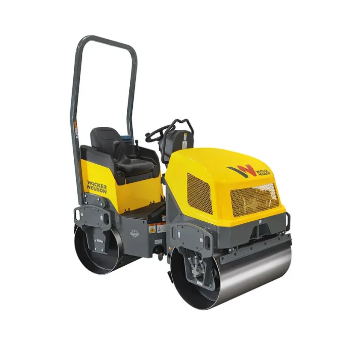 COMPACTADORES Rodillo compactador amarillos y grises con asientos y ruedas delanteras grandes.